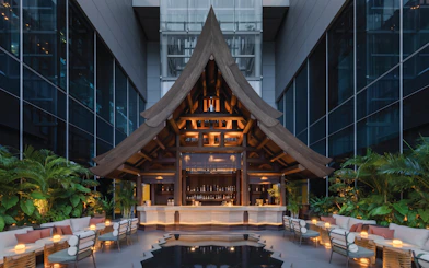 Rooftop bar with wooden architecture at Akara Sky Hanuman, One City Centre, Bangkok.
