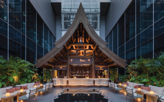 Rooftop bar with wooden architecture at Akara Sky Hanuman, One City Centre, Bangkok.