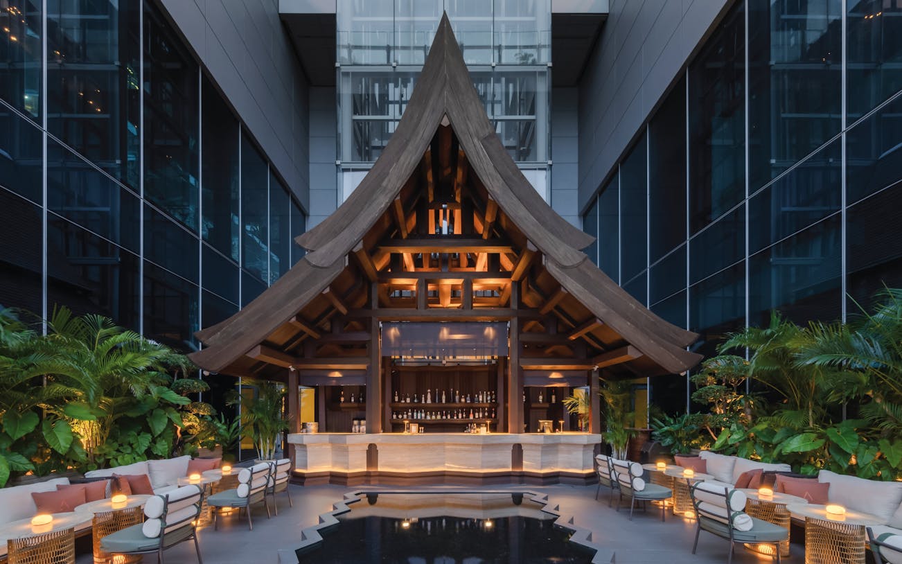 Rooftop bar with wooden architecture at Akara Sky Hanuman, One City Centre, Bangkok.