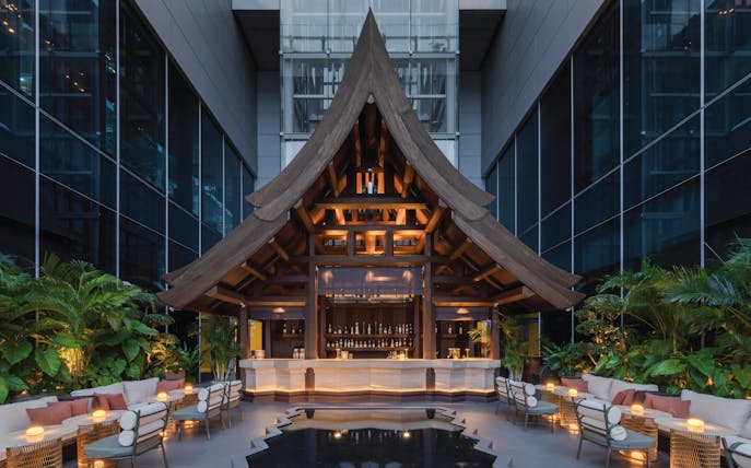 Rooftop bar with wooden architecture at Akara Sky Hanuman, One City Centre, Bangkok.