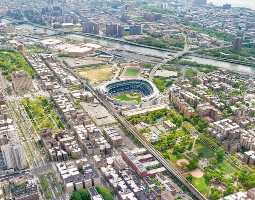 Aerial view of Yankee Stadium in the Bronx, New York City, surrounded by urban landscape.