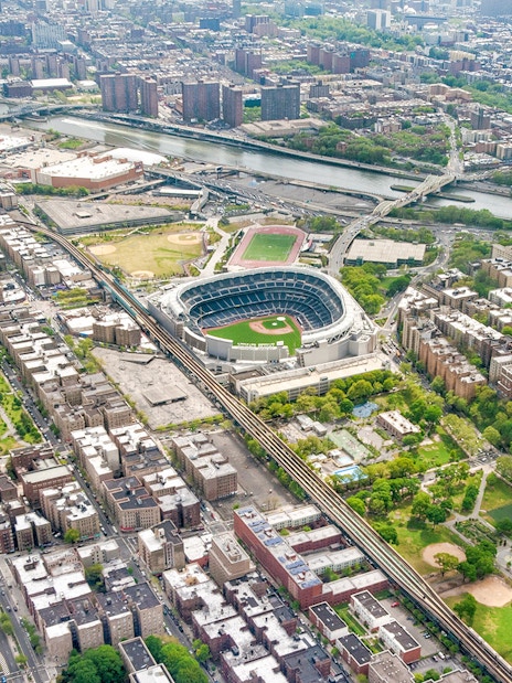 Aerial view of Yankee Stadium in the Bronx, New York City, surrounded by urban landscape.