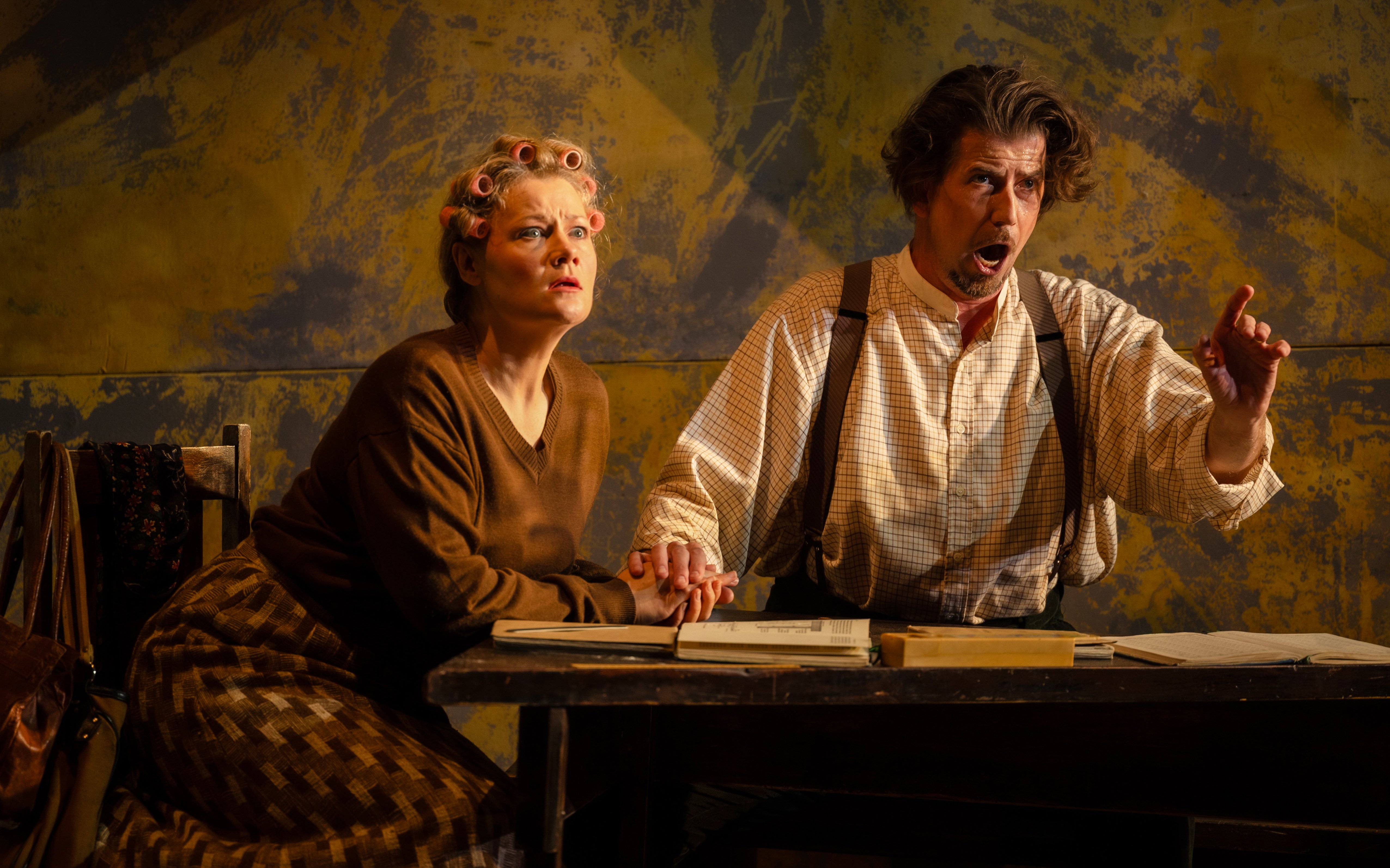 Actors performing a scene from Hansel and Gretel on stage.