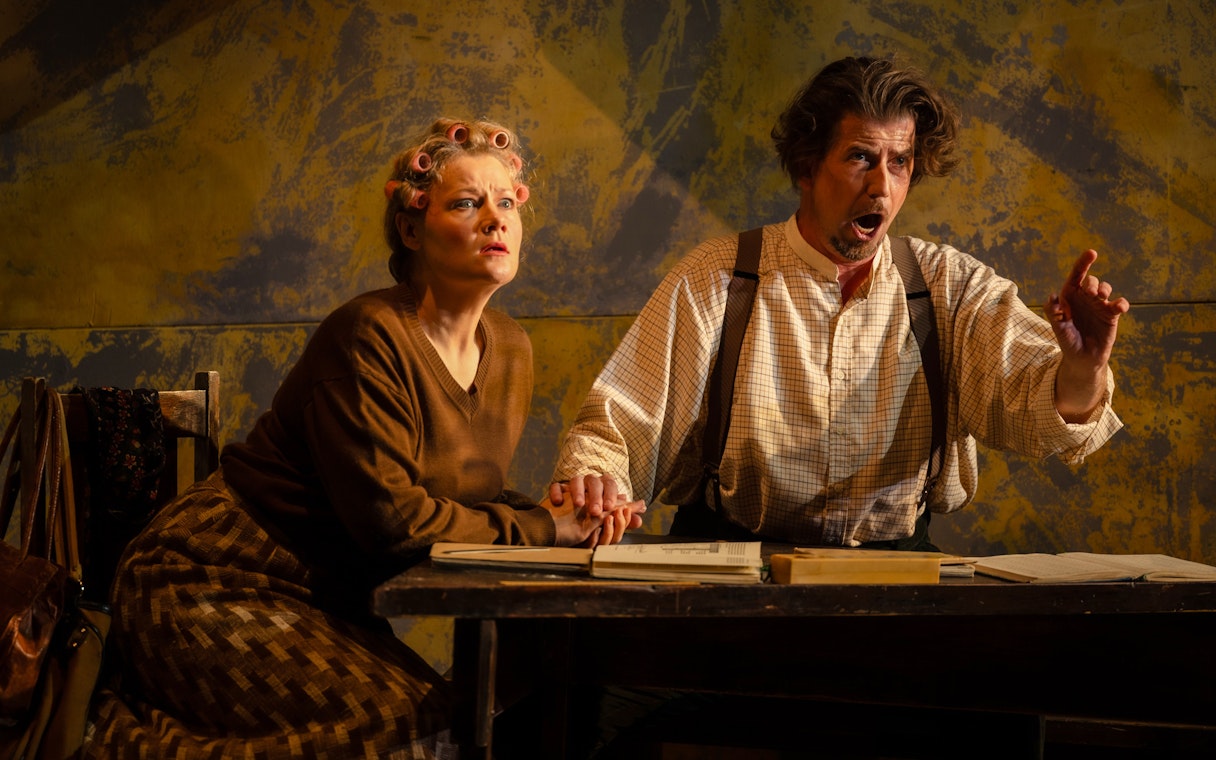 Actors performing a scene from Hansel and Gretel on stage.