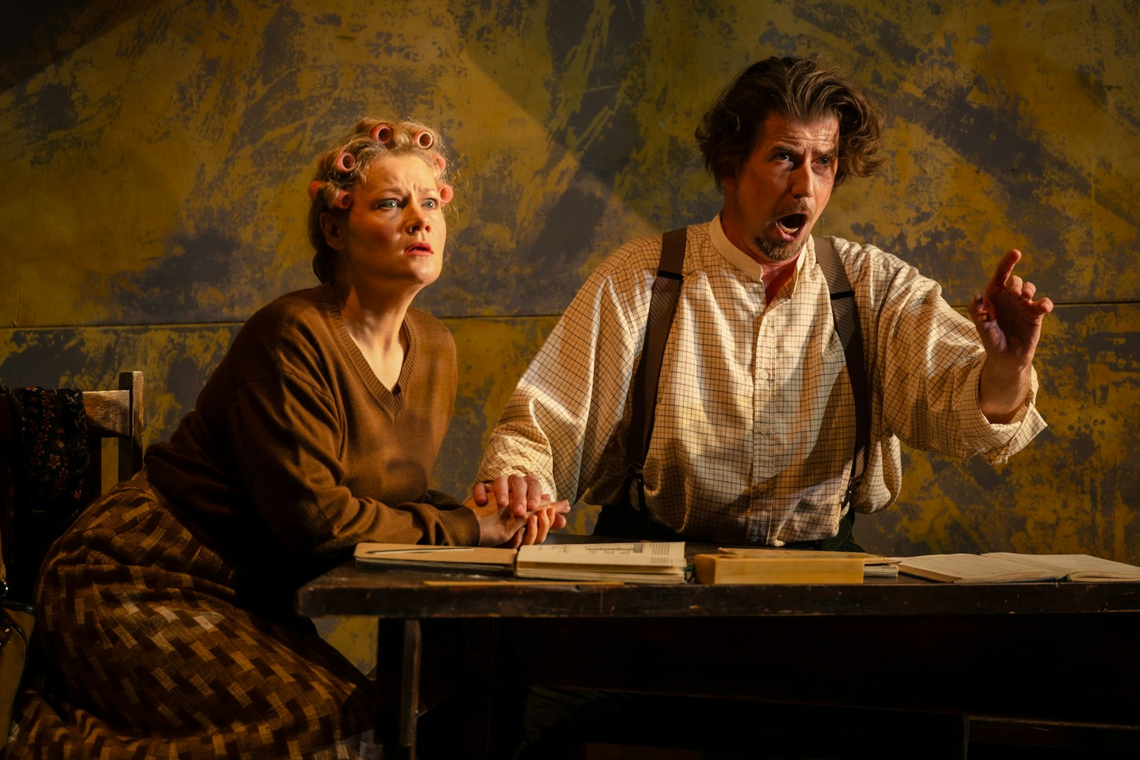 Actors performing a scene from Hansel and Gretel on stage.