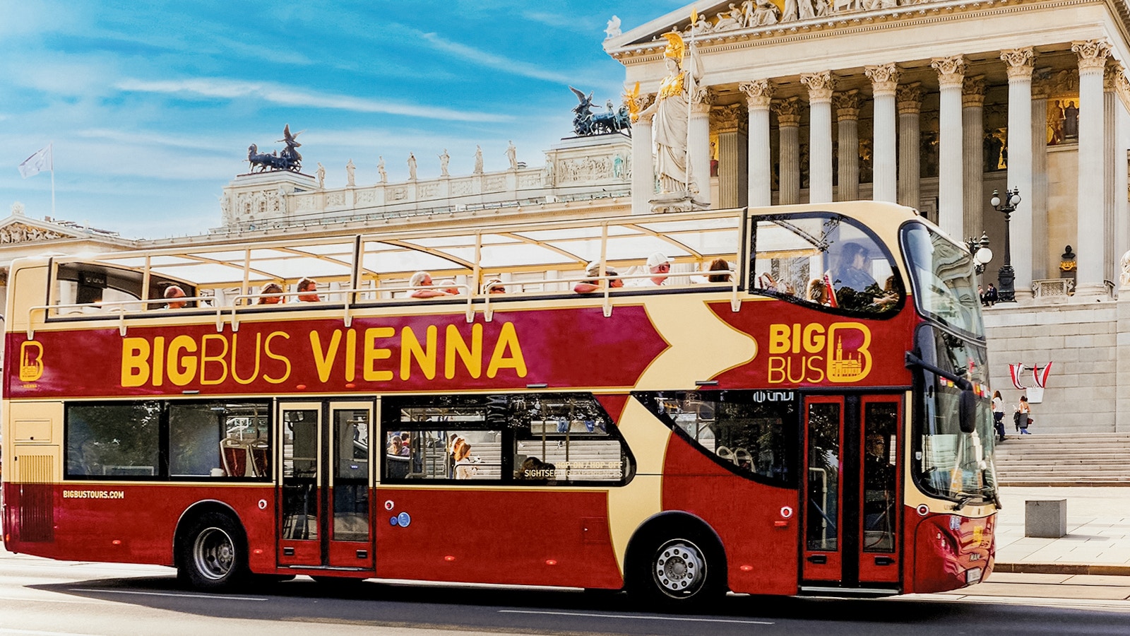 Vienna Big Bus tour passing by historic buildings and landmarks.