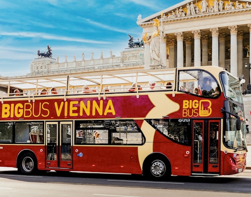 Vienna Big Bus tour passing by historic buildings and landmarks.