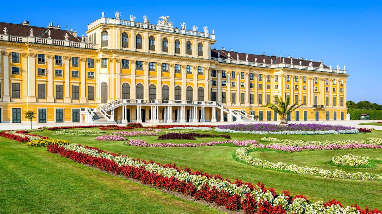 Schönbrunn Palace facade with vibrant gardens, Vienna.