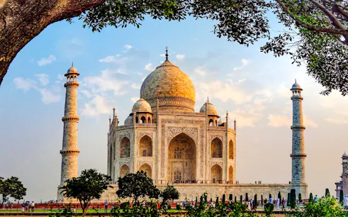 Taj Mahal in Agra with visitors, part of a private day trip from Delhi including 5-star lunch.