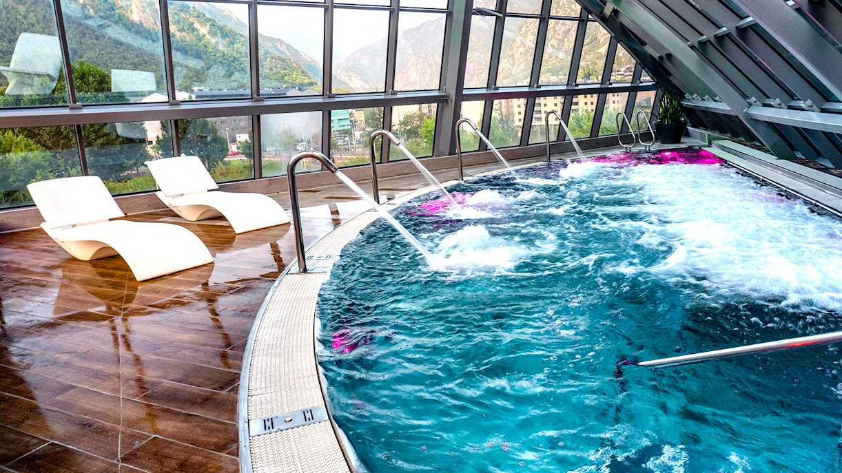 Caldea spa interior with mountain backdrop in Andorra, highlighting Caldea Classic Entry Tickets.