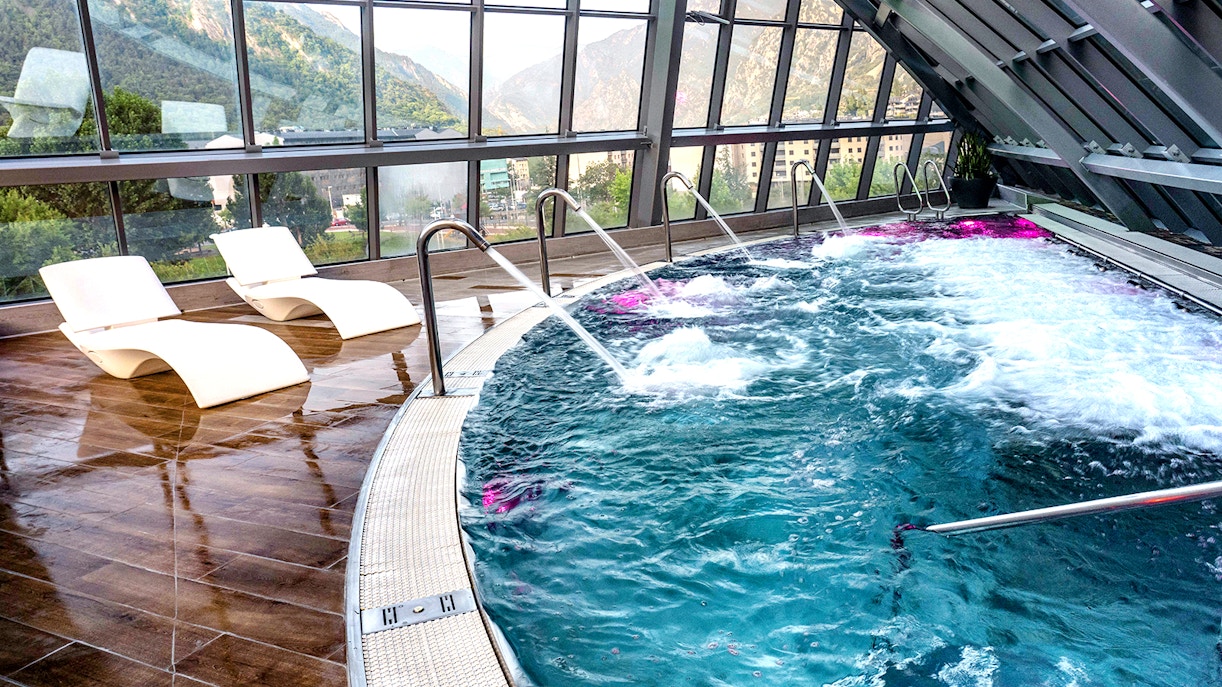 Caldea spa interior with mountain backdrop in Andorra, highlighting Caldea Classic Entry Tickets.