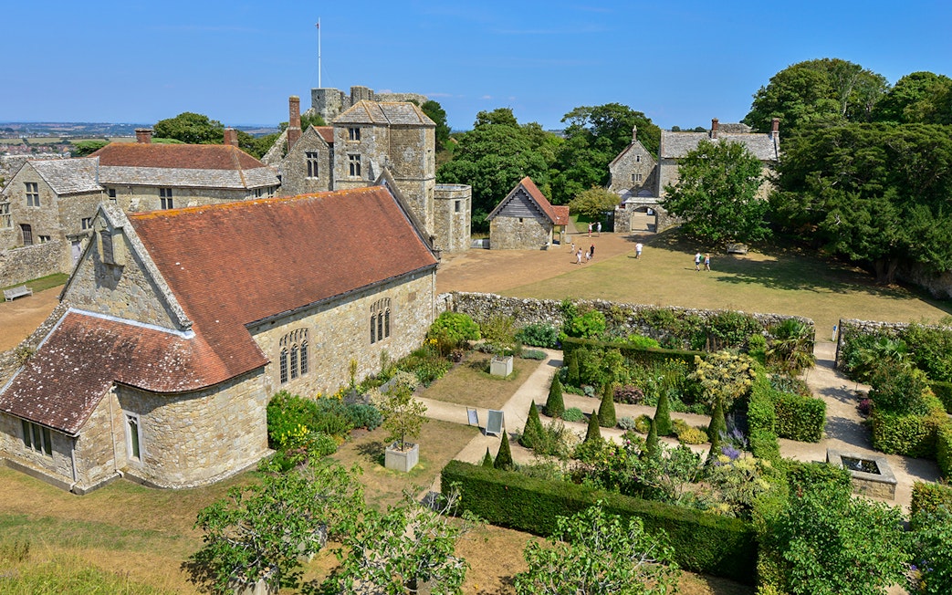 Carisbrooke Castle gardens and historic buildings on a sunny day, Isle of Wight.