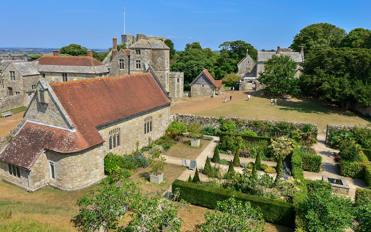 Carisbrooke Castle gardens and historic buildings on a sunny day, Isle of Wight.