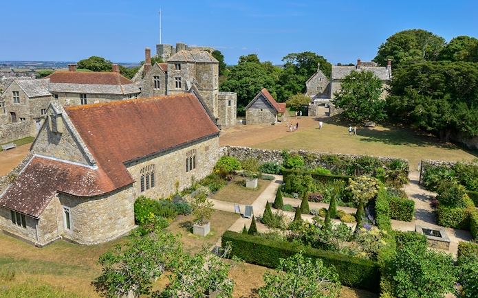 Carisbrooke Castle gardens and historic buildings on a sunny day, Isle of Wight.