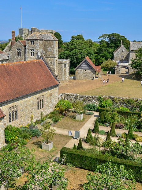 Carisbrooke Castle gardens and historic buildings on a sunny day, Isle of Wight.