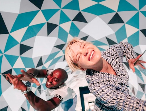 Visitors enjoying optical illusions at Paradox Museum, France.