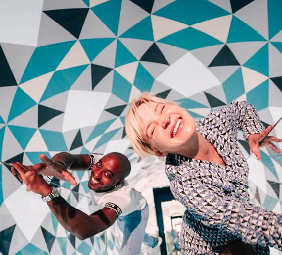 Visitors enjoying optical illusions at Paradox Museum, France.