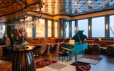 Siam Societies lounge with blue piano on the 58th floor of Akara Sky Hanuman in Bangkok.