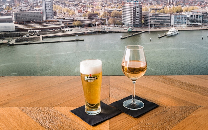 Drinks overlooking Amsterdam skyline from ADAM Lookout.