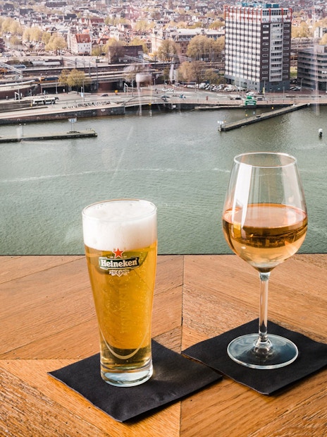 Drinks overlooking Amsterdam skyline from ADAM Lookout.