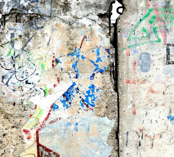 Berlin Wall section with colorful graffiti, showcasing historical significance in Berlin, Germany.