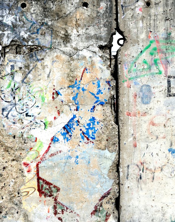 Berlin Wall section with colorful graffiti, showcasing historical significance in Berlin, Germany.