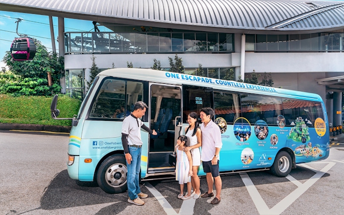 Family boarding tour bus at Singapore cable car station.