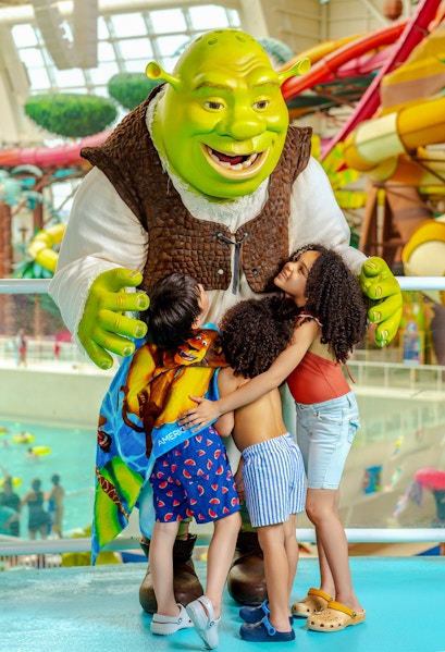 Shrek hugging children at American Dream water park.