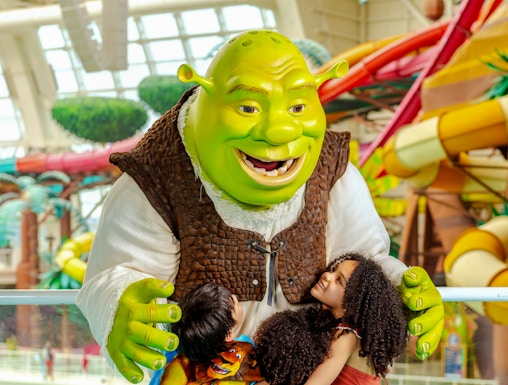 Shrek hugging children at American Dream water park.