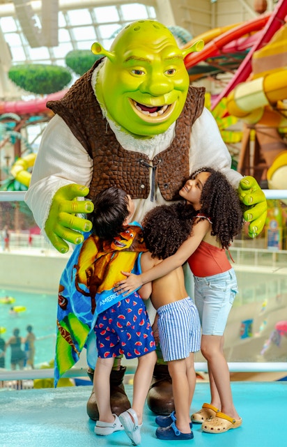 Shrek hugging children at American Dream water park.