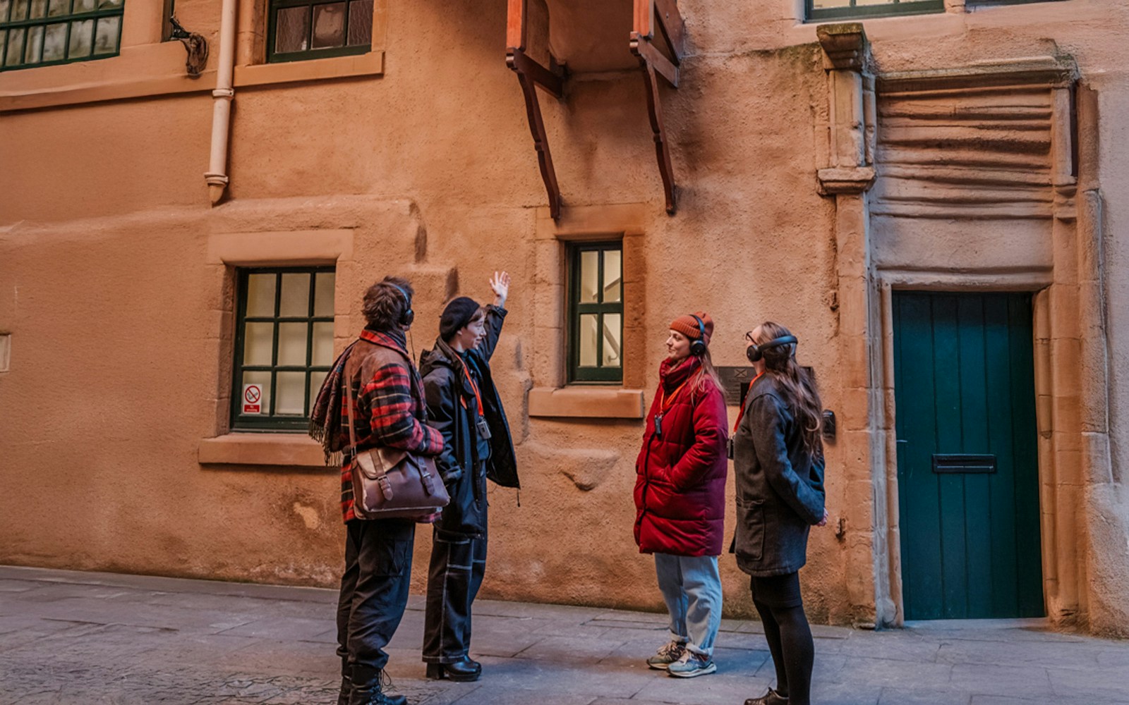 Tour group on the Royal Mile in Edinburgh listening to a guide.
