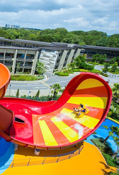 Visitors enjoying a water slide at Wild Wild Wet, Singapore.