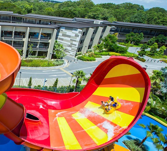 Visitors enjoying a water slide at Wild Wild Wet, Singapore.