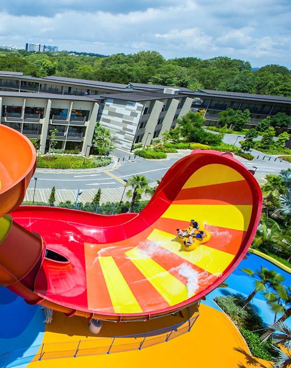 Visitors enjoying a water slide at Wild Wild Wet, Singapore.