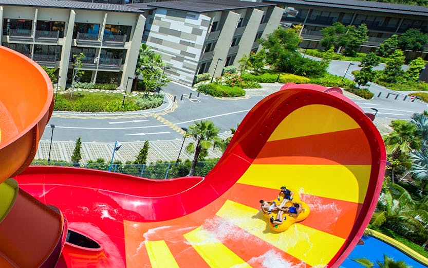 Visitors enjoying a water slide at Wild Wild Wet, Singapore.