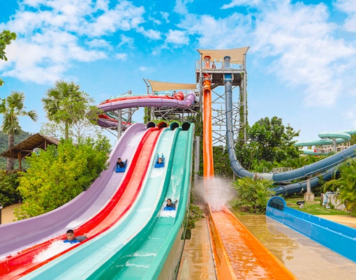 People coming down waterslides at Ramayana Water Park