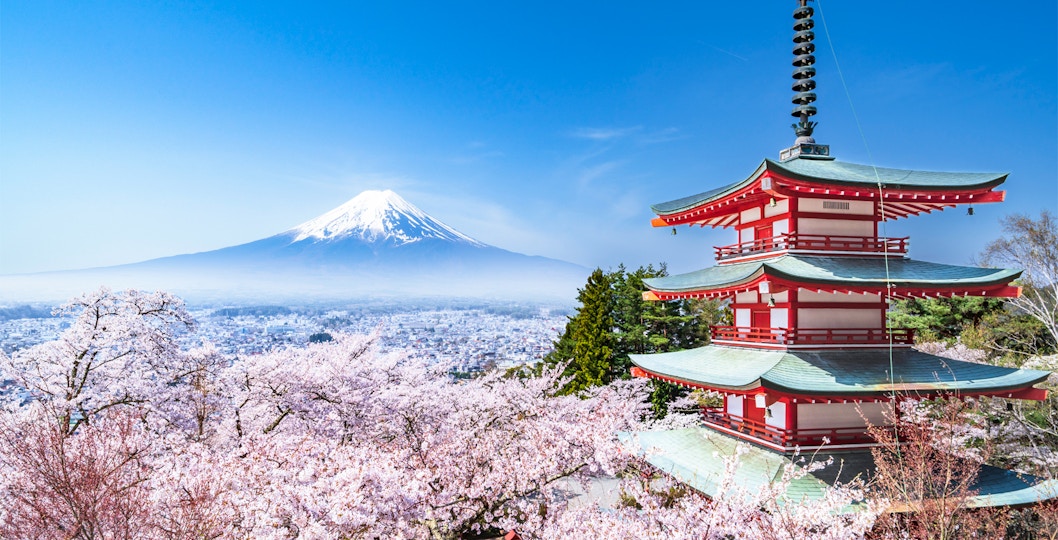 Pagoda with cherry blossoms and Mt. Fuji view from Arakurayama Sengen Park, Japan.
