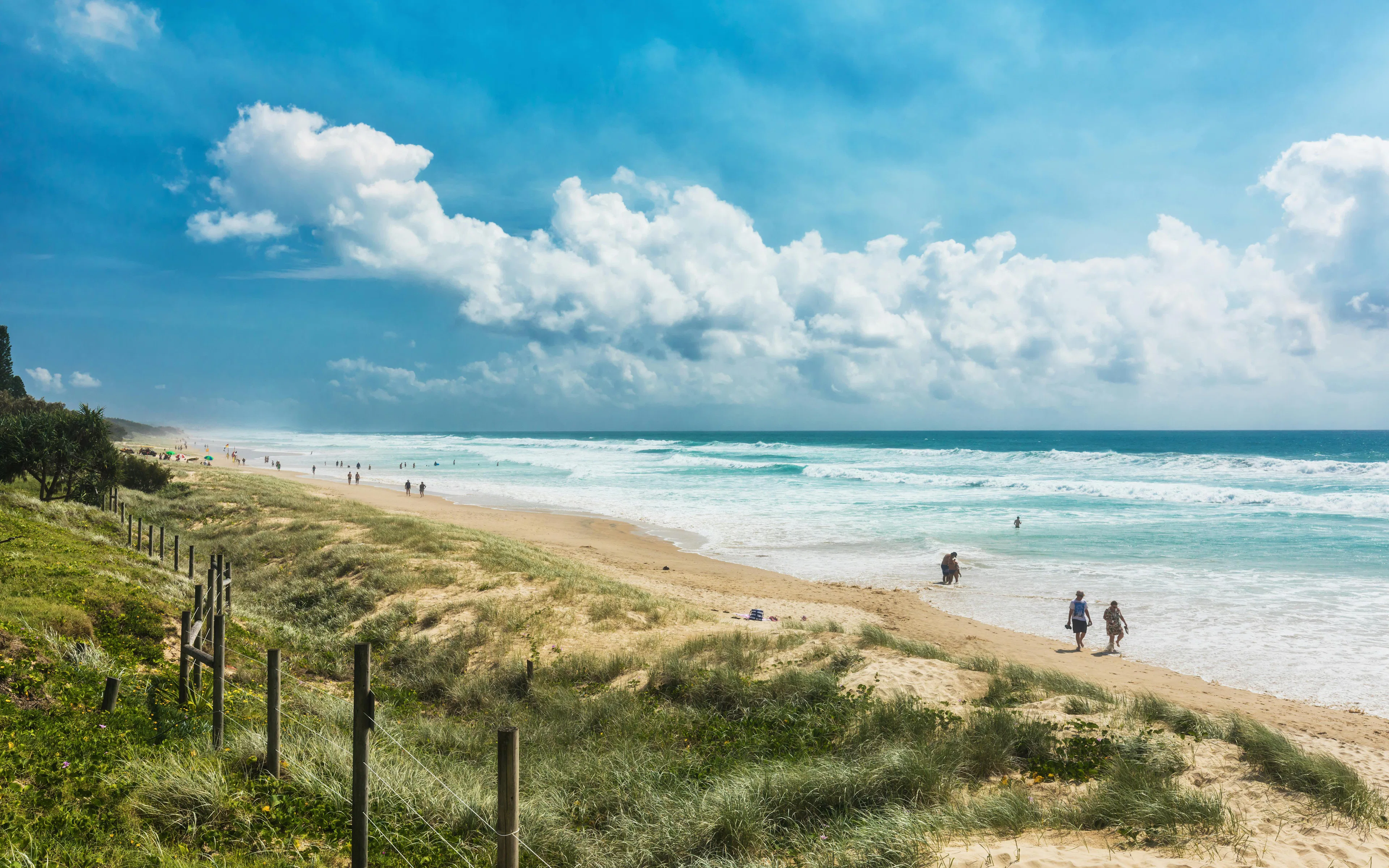 People enjoying the beach at Coolum Main Beach, Queensland, Australia.