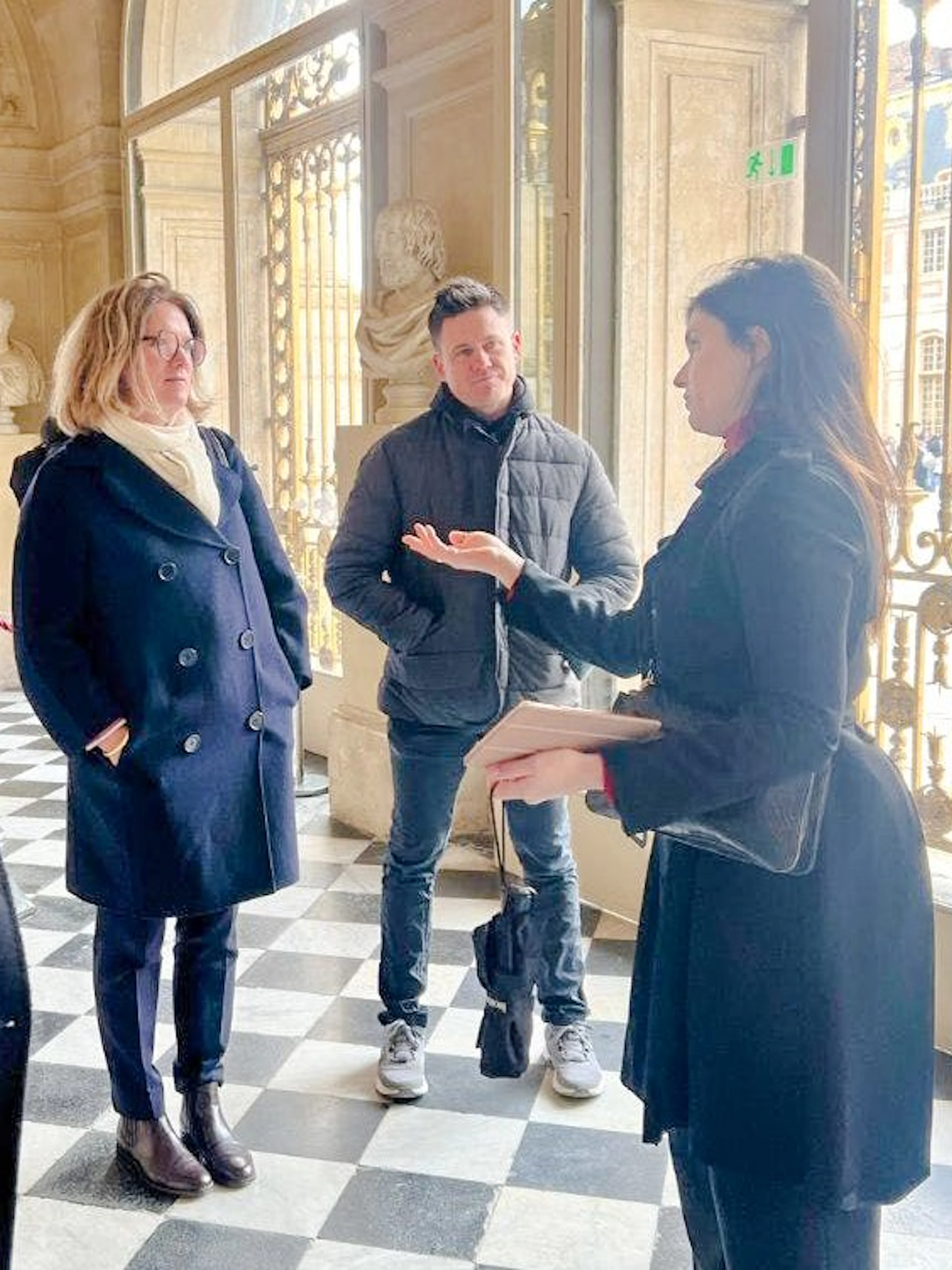 Tour group inside the King's Private Apartments at Palace of Versailles.