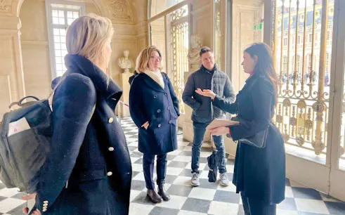 Tour group inside the King's Private Apartments at Palace of Versailles.