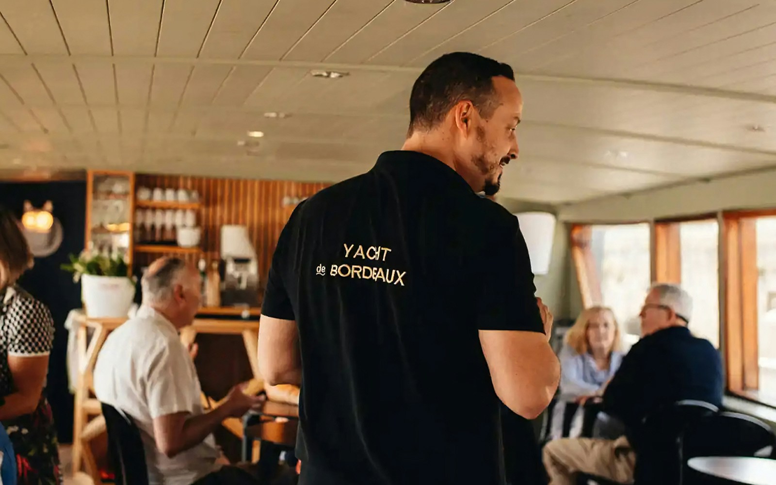 Guide giving live commentary on Bordeaux River Cruise.