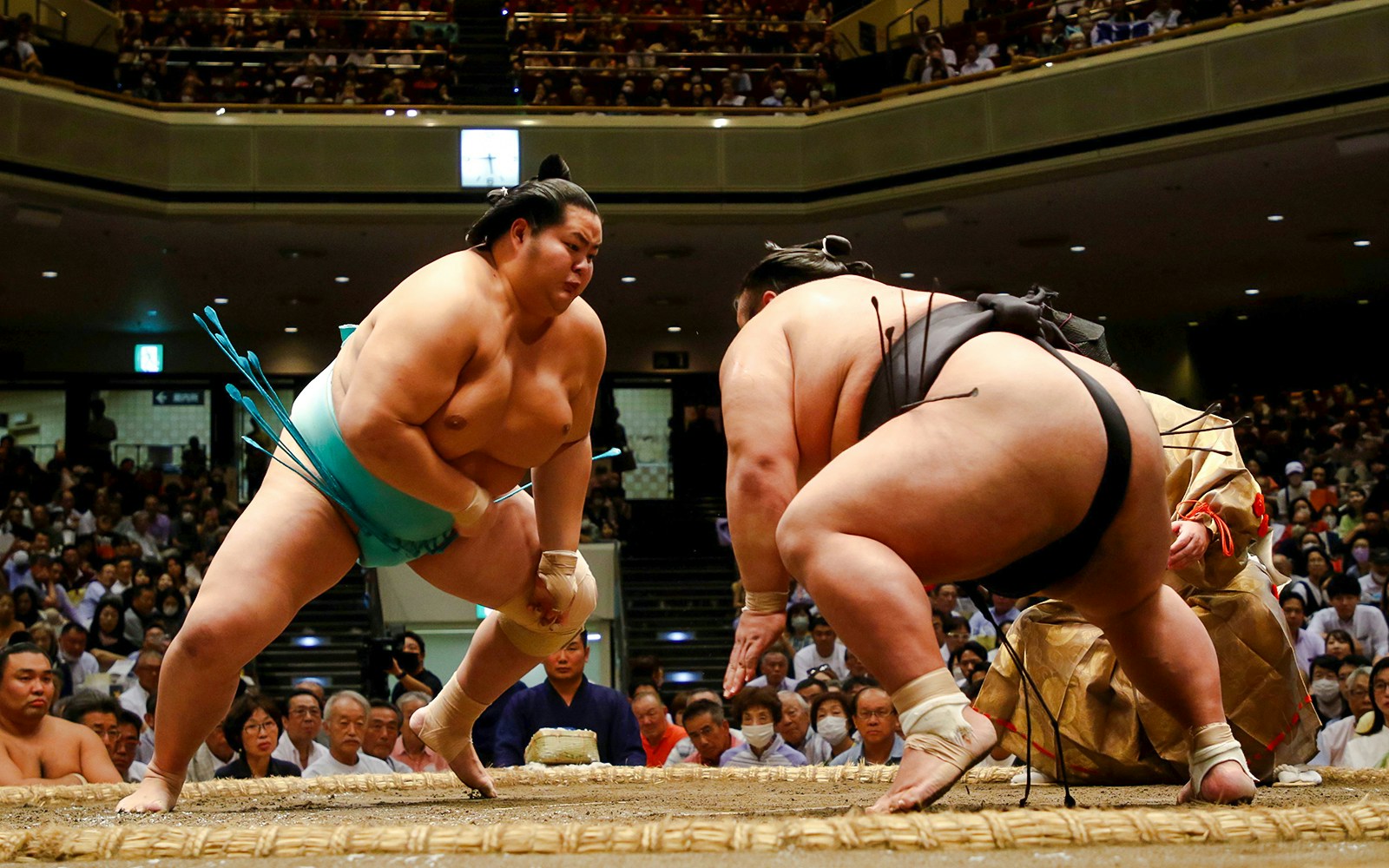Wrestlers competing in Fukuoka Sumo Tournament arena.