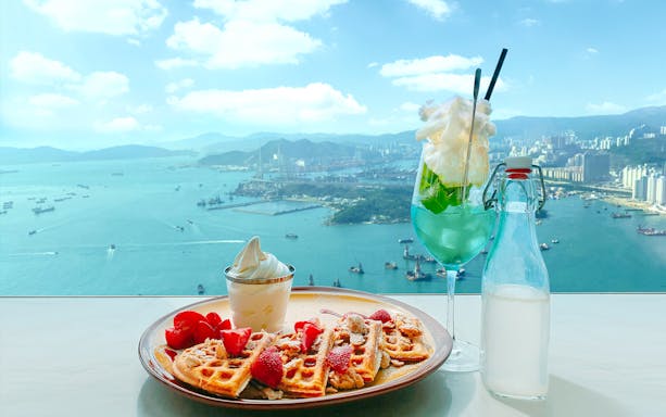 Waffles and ice cream with a drink overlooking Victoria Harbour from Sky100, Hong Kong.