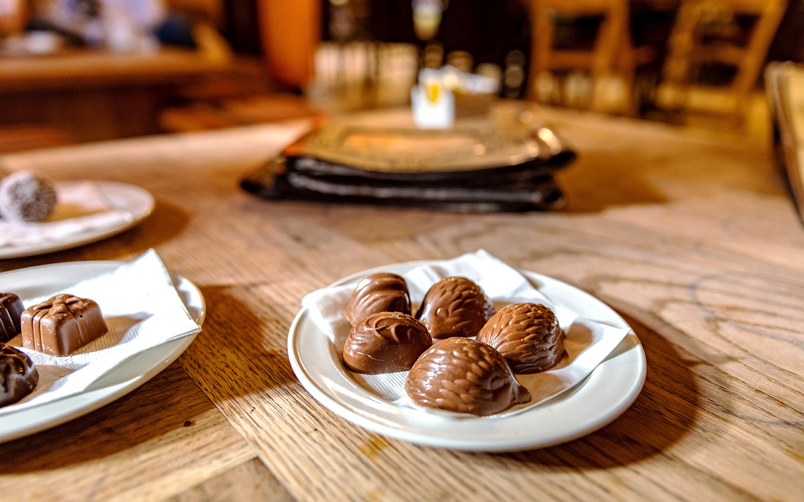 Malta chocolate boutique interior with assorted chocolates on display shelves.