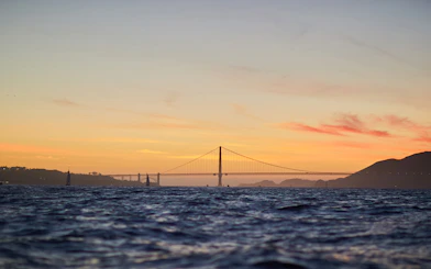 Golden Gate Bridge at sunset viewed from San Francisco Bay.