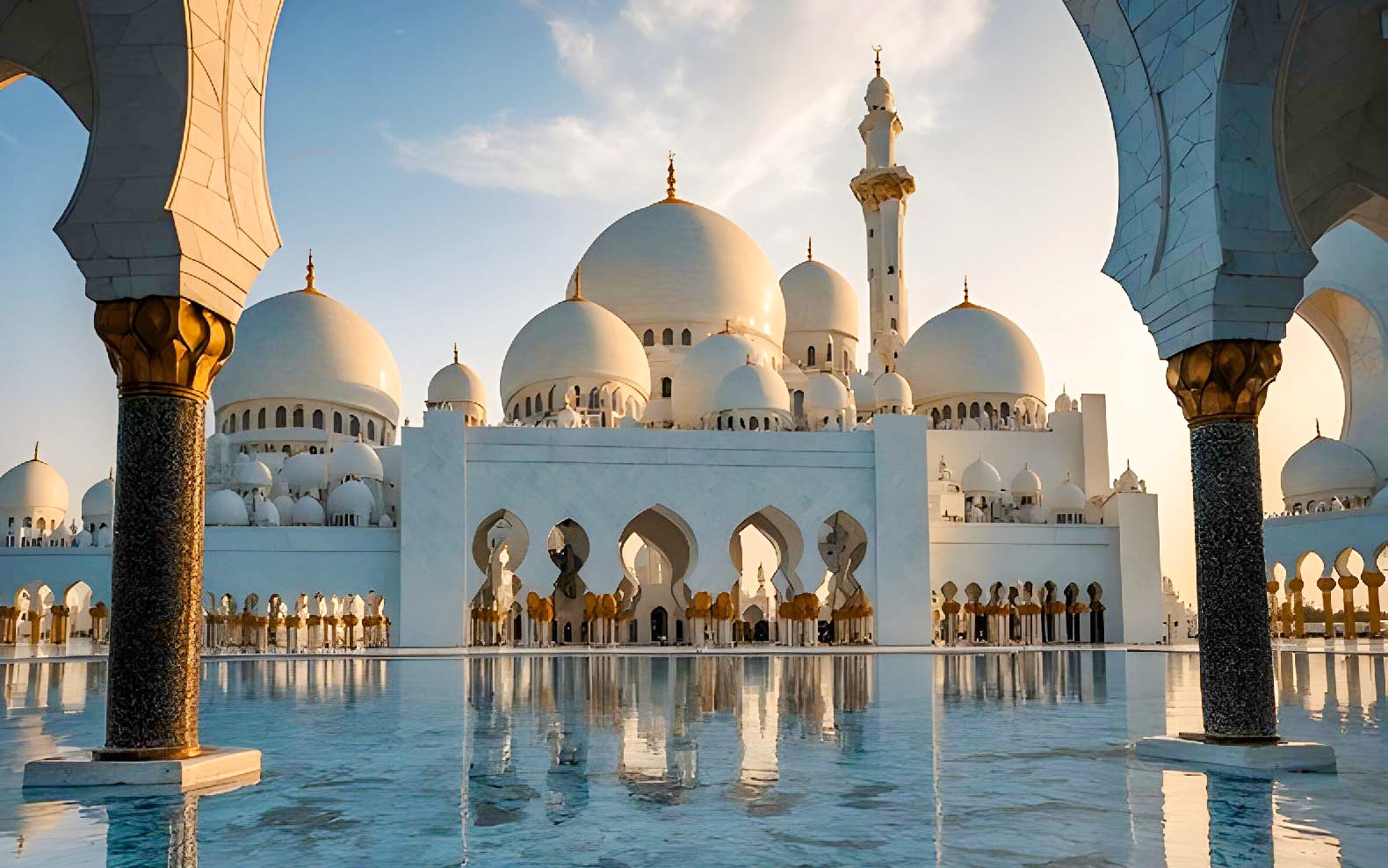 Sheikh Zayed Grand Mosque reflecting in water at sunset, Abu Dhabi, UAE.