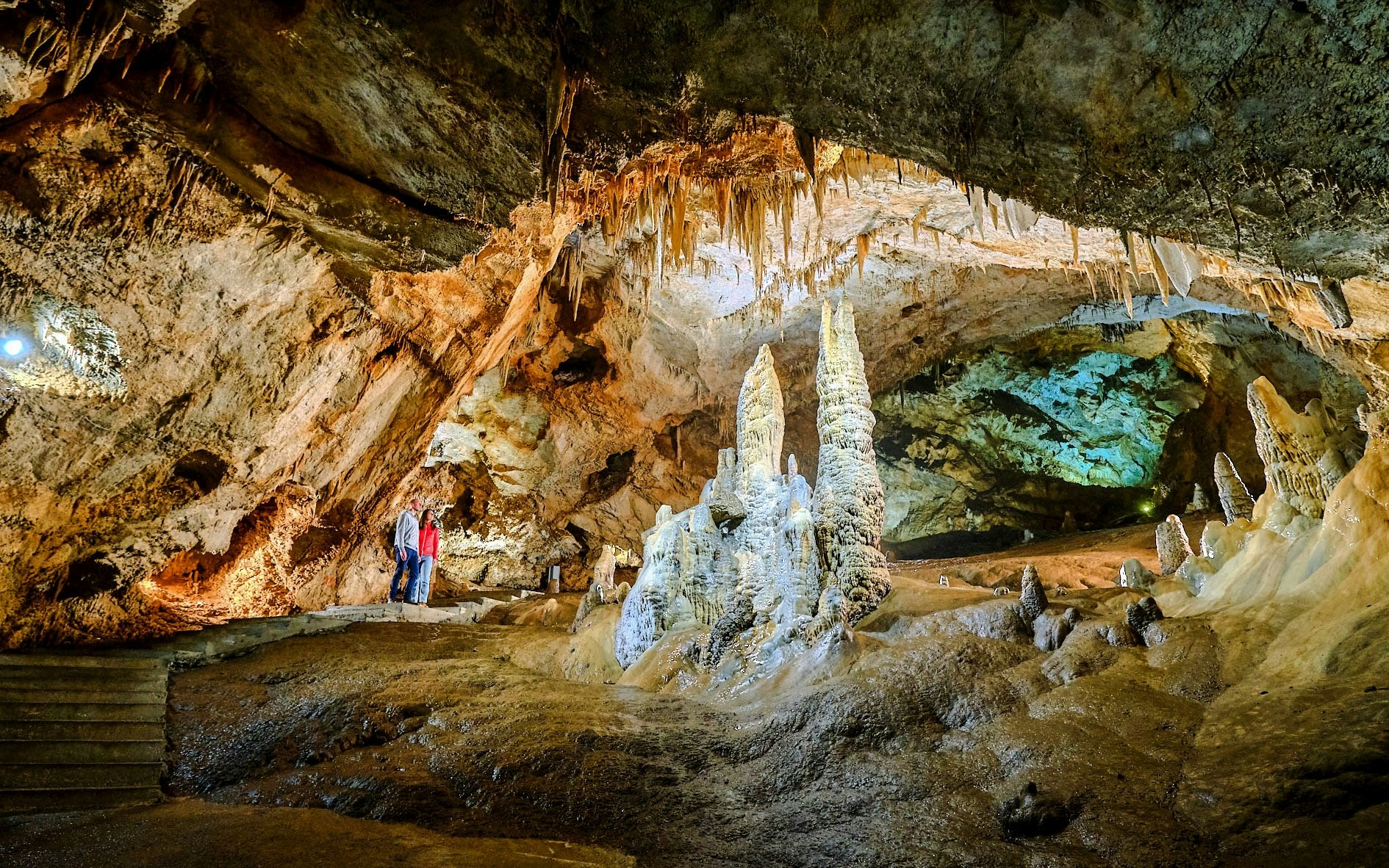 Tourists exploring stalagmites and stalactites inside Lipa Cave, Cetinje.