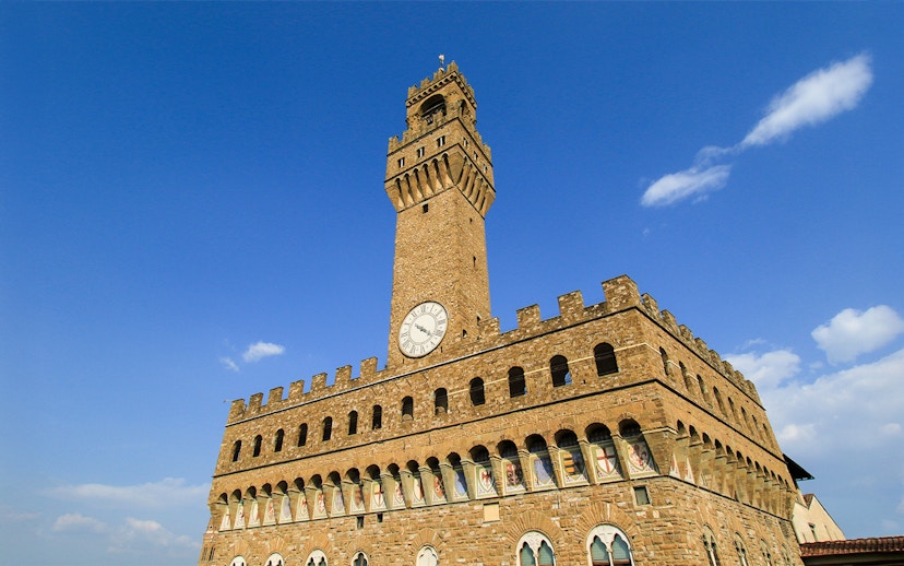 Arnolfo Tower exterior with clock, Florence, Italy.