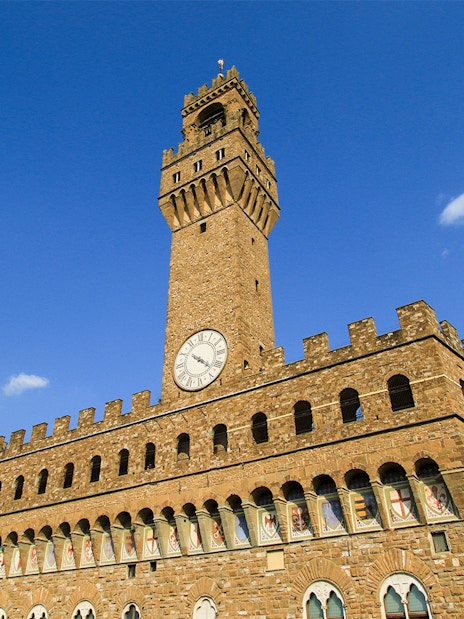 Arnolfo Tower exterior with clock, Florence, Italy.
