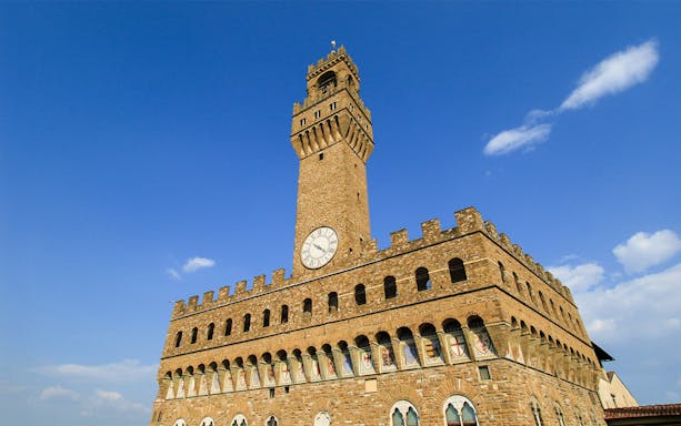 Arnolfo Tower exterior with clock, Florence, Italy.